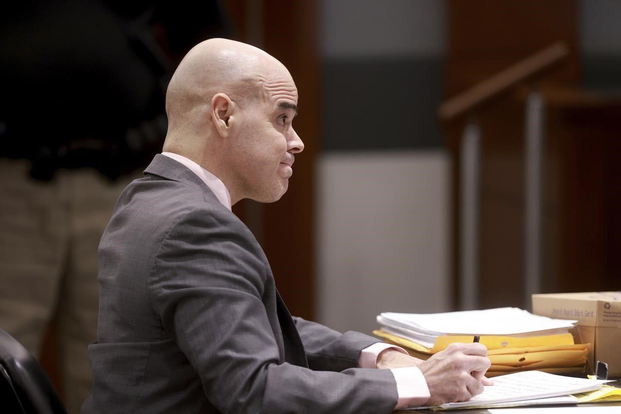 Key police testimony caps first week of ex-politician's trial in Las Vegas reporter's death